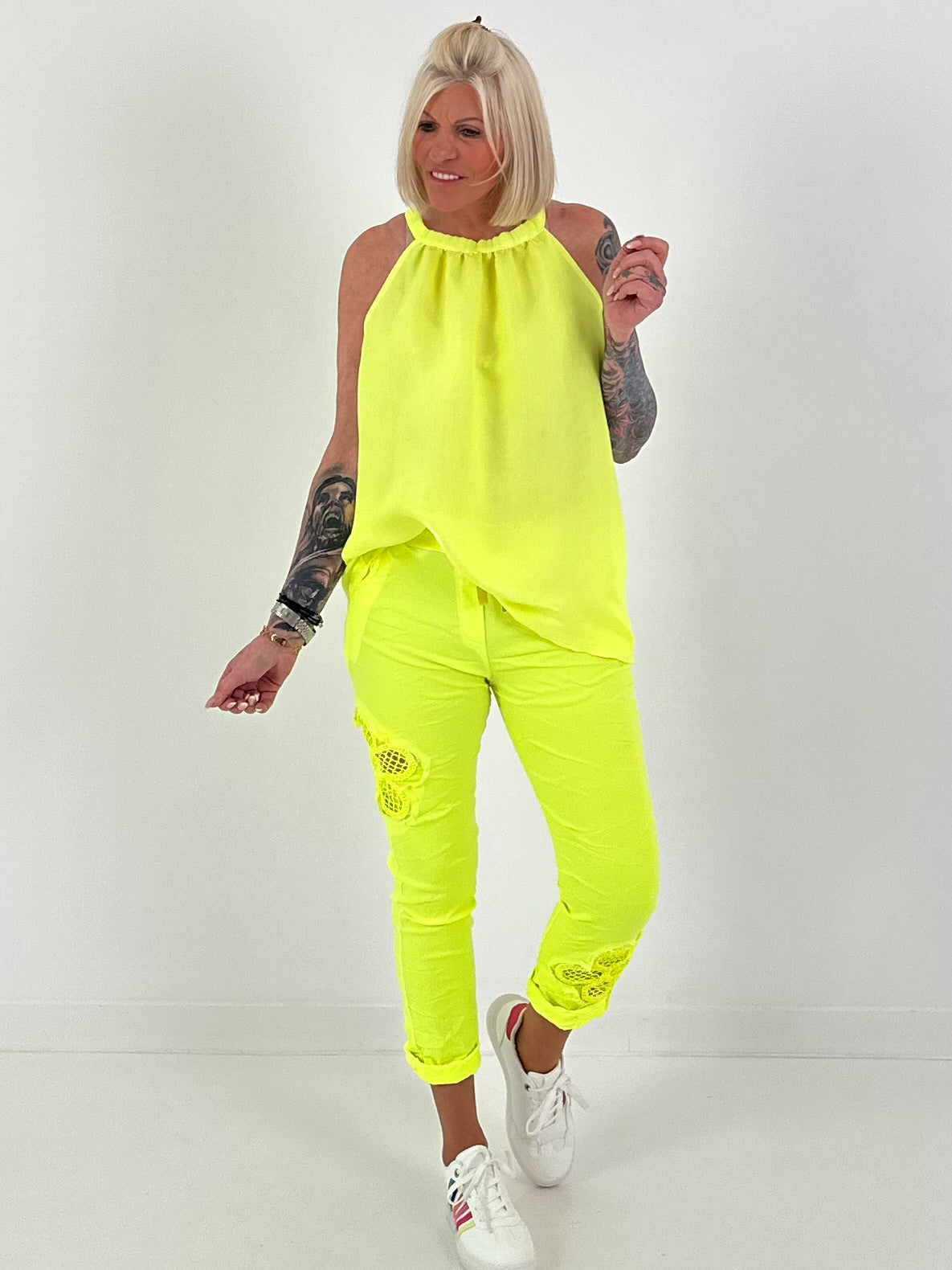 Pants with crocheted flowers - neon yellow