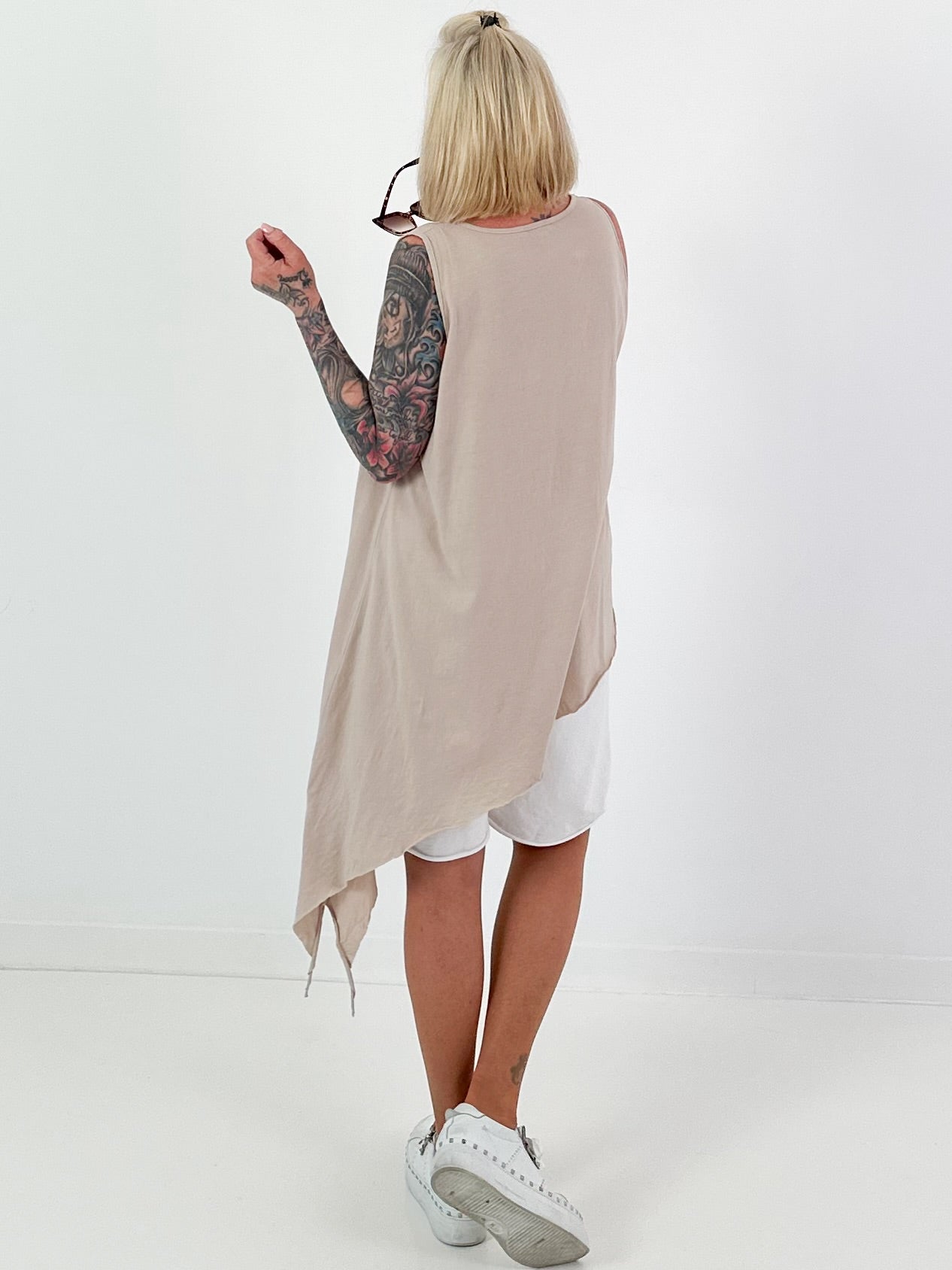 Asymmetric long top with eyelets - beige