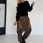 Pullover mit Cut-Outs und Statement-Perlen - schwarz
