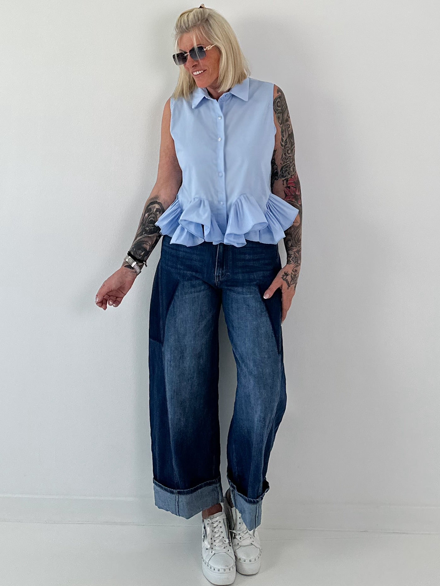 Sleeveless blouse with ruffles - light blue