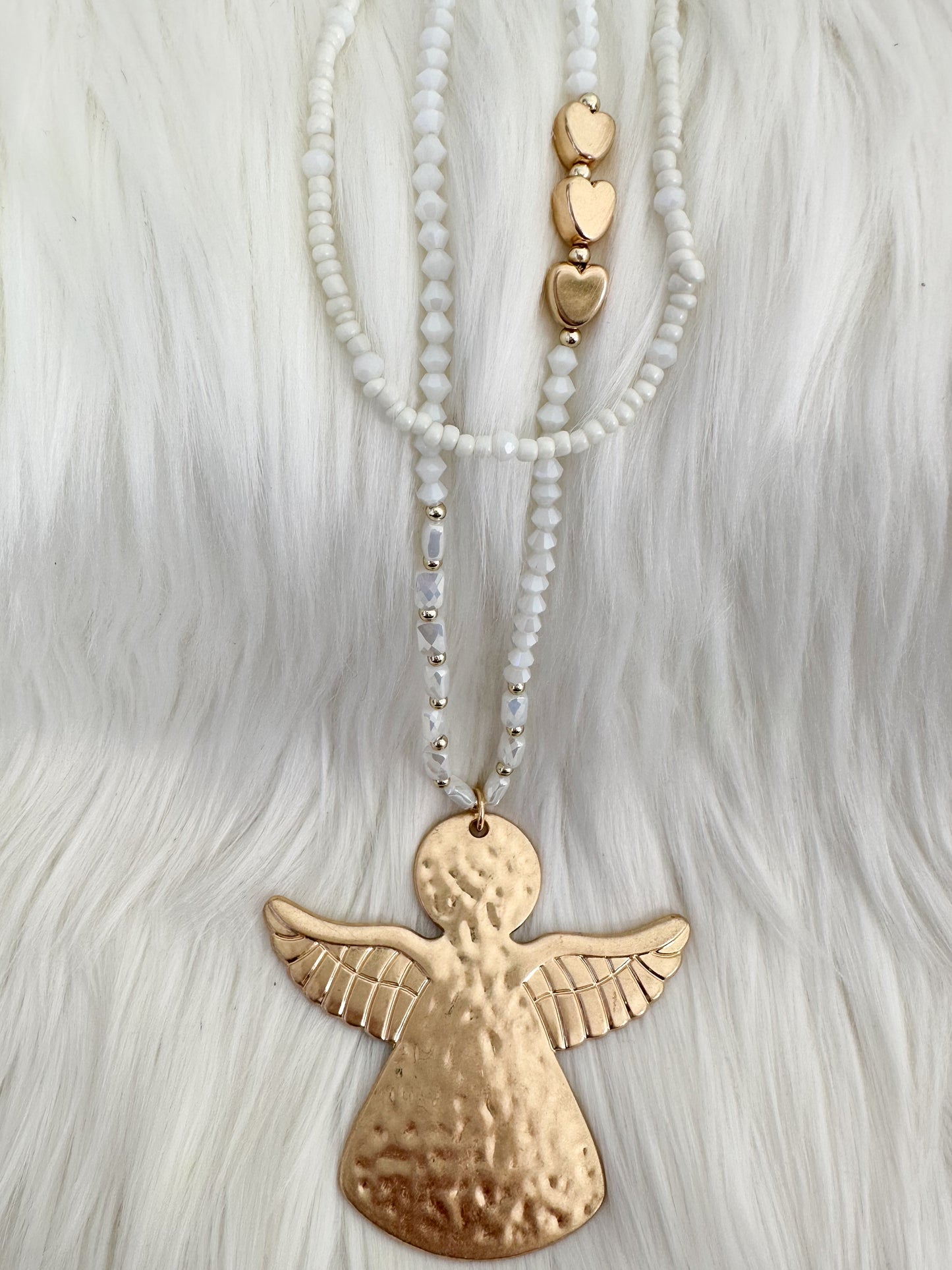 Necklace with angel pendant - white gold