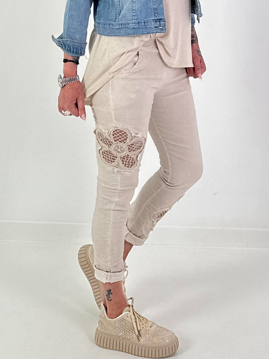 Trousers with crocheted flower inserts - beige