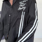 Hemdbluse mit Lederoptik-Elementen und Statement-Patch - schwarz