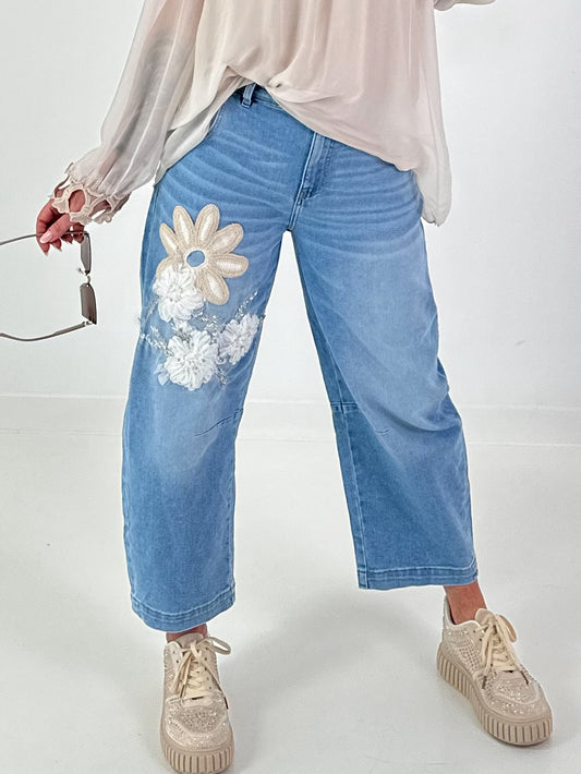 Bottle jeans with floral appliqués - denim