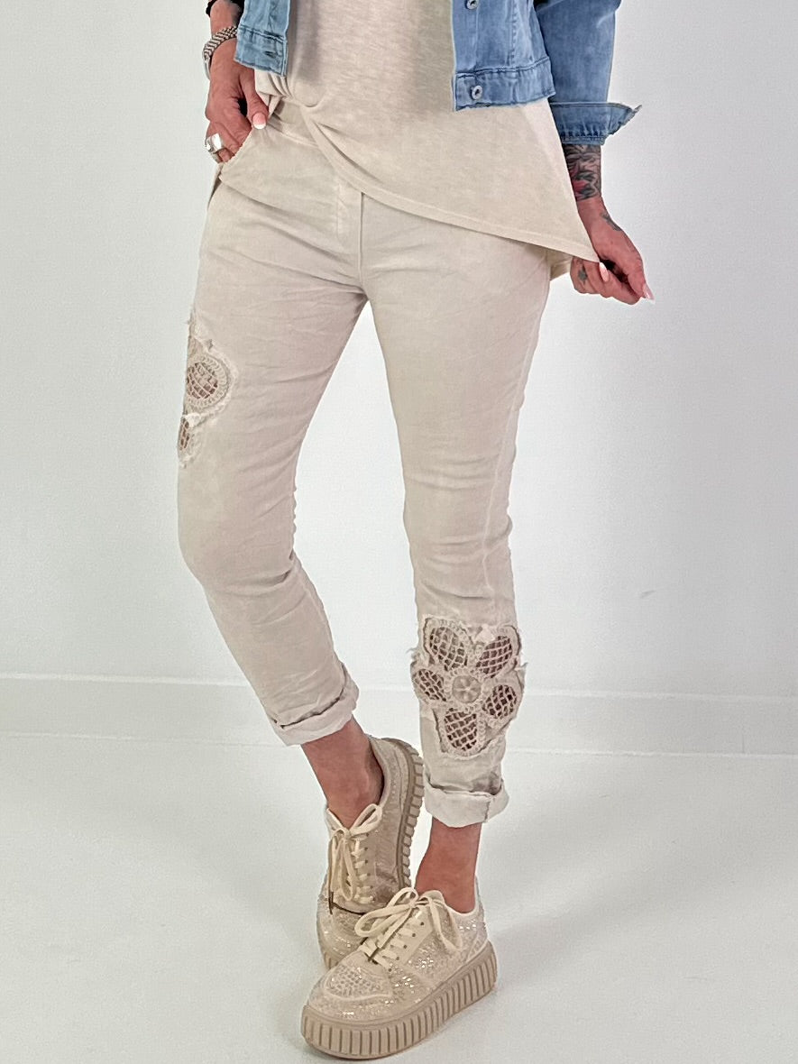 Trousers with crocheted flower inserts - beige