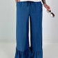 Dark blue jeans with flounced hem