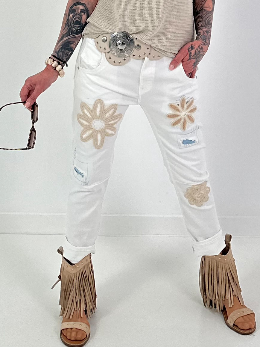 Jeans with crocheted floral appliqués - white