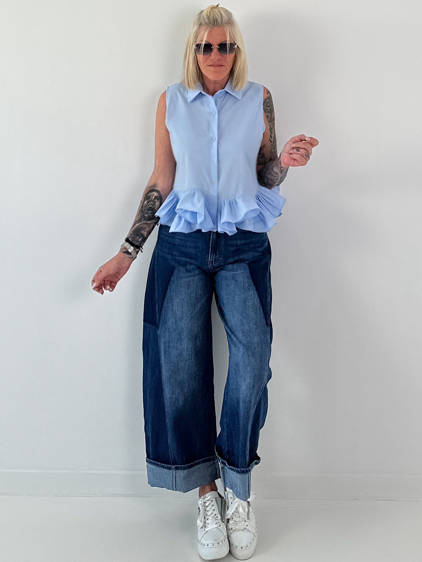 Sleeveless blouse with ruffles - light blue