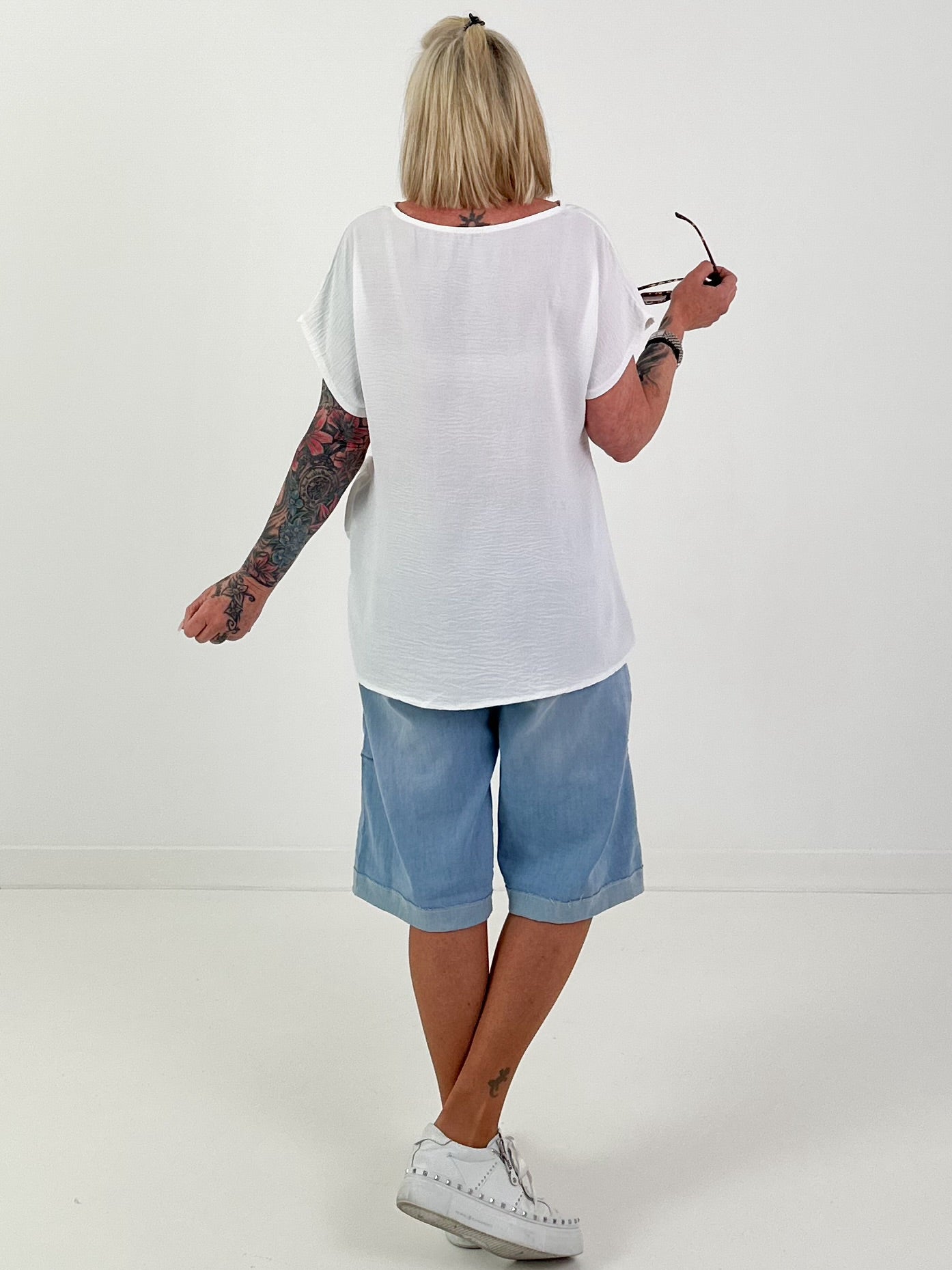 Blouse-style top with side tie knot - white