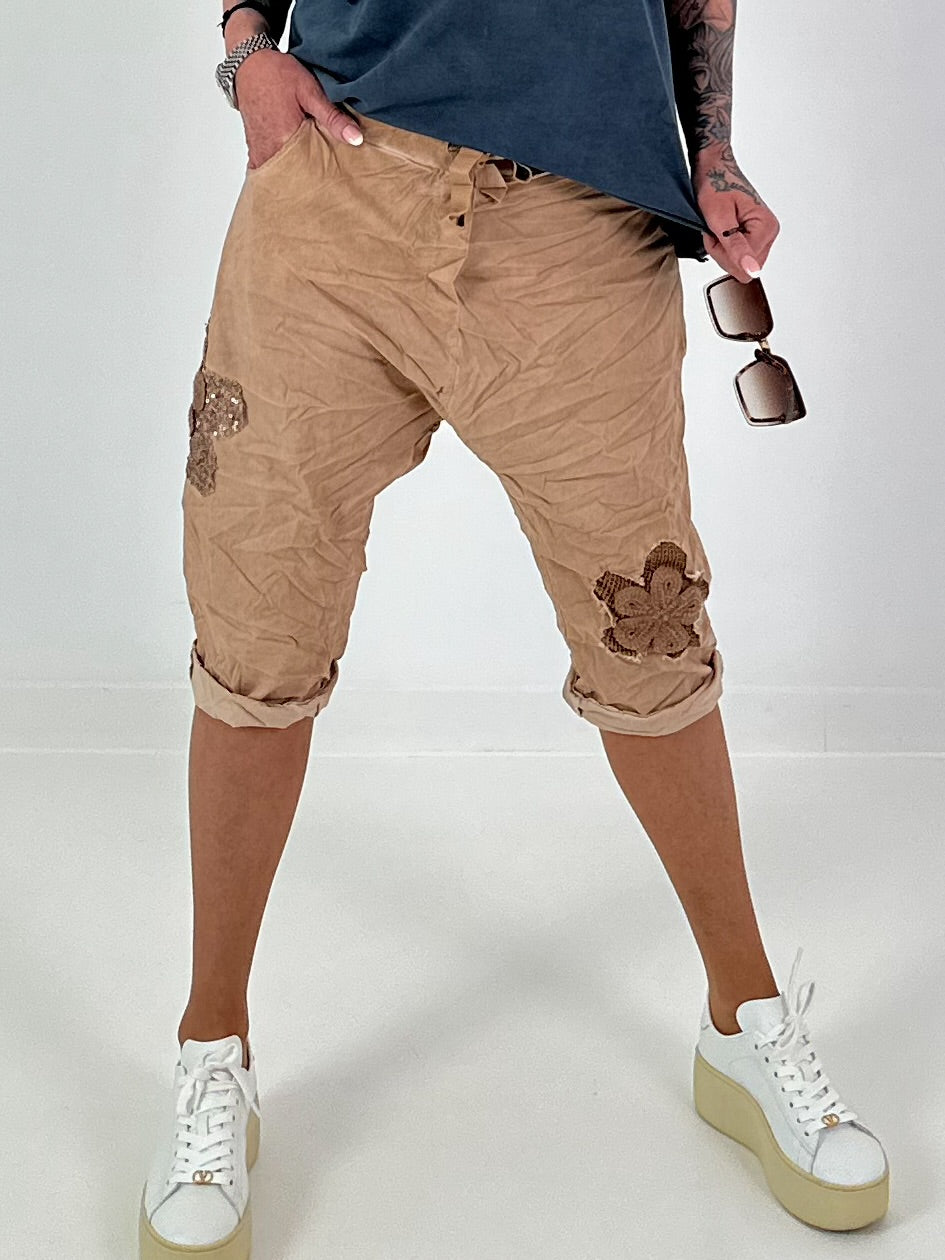 Short baggy shorts with crocheted flowers and sequins - camel