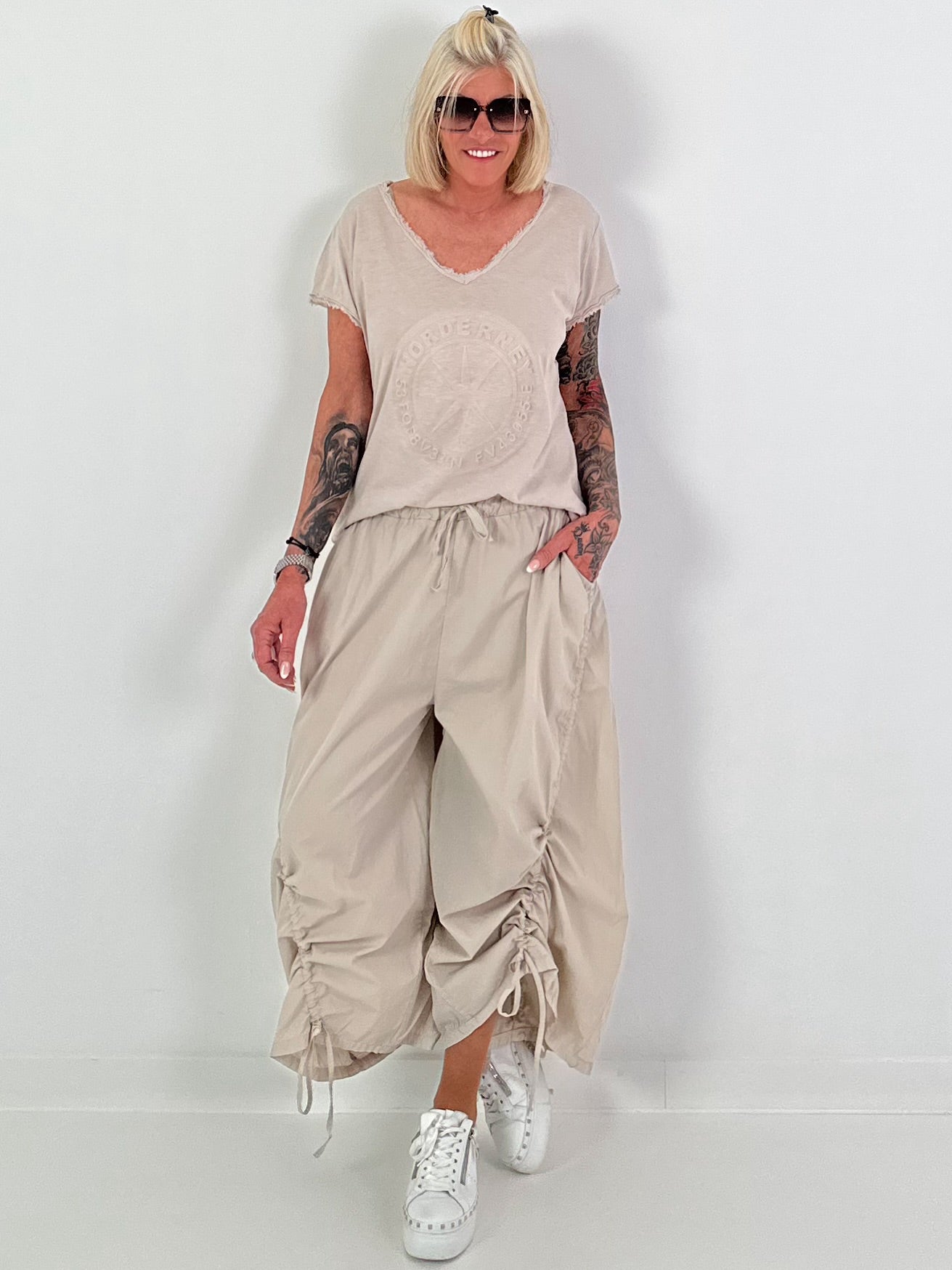 Balloon trousers with gathering seams - beige