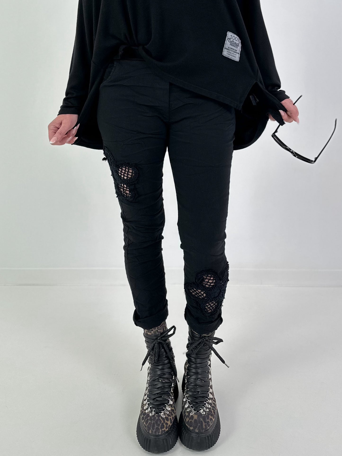 Trousers with crocheted flower inserts - black