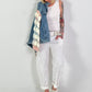 Denim jacket with crocheted sleeves