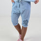 Short Baggy Shorts with Crocheted Flowers and Sequins - Light Blue