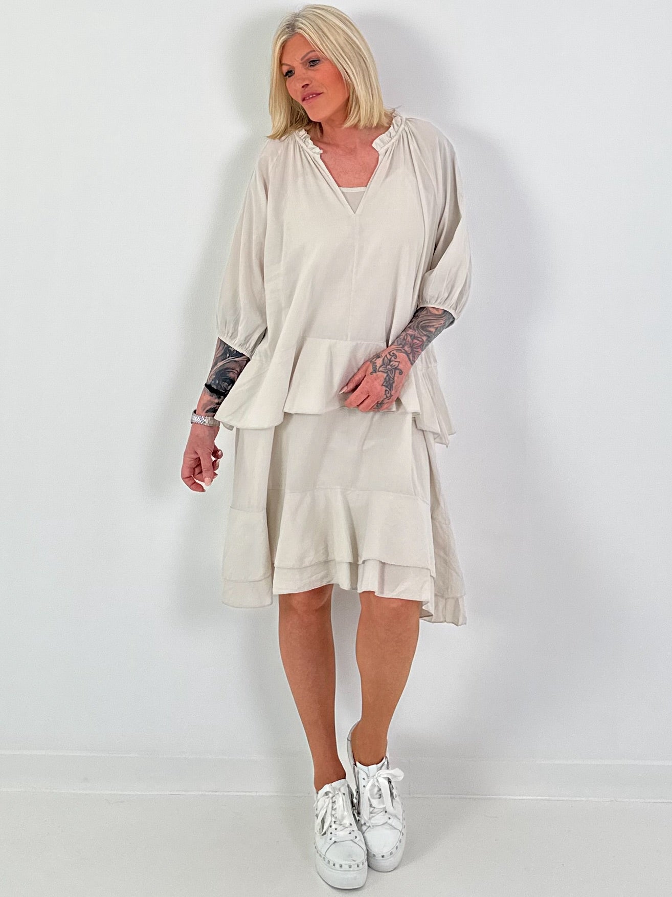 Dress with undershirt top and flounces - beige