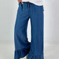 Dark blue jeans with flounced hem
