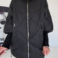Oversized Steppjacke mit Stulpenärmeln und Kapuze - schwarz