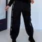 Hose mit City-Statement-Print - schwarz