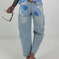 Jeans with floral crochet inserts at the sides - denim