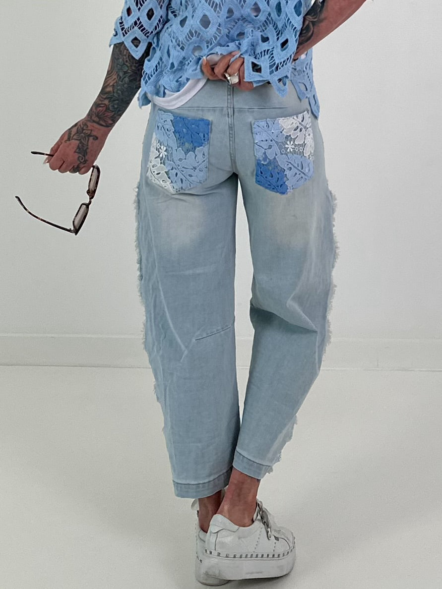Jeans with floral crochet inserts at the sides - denim
