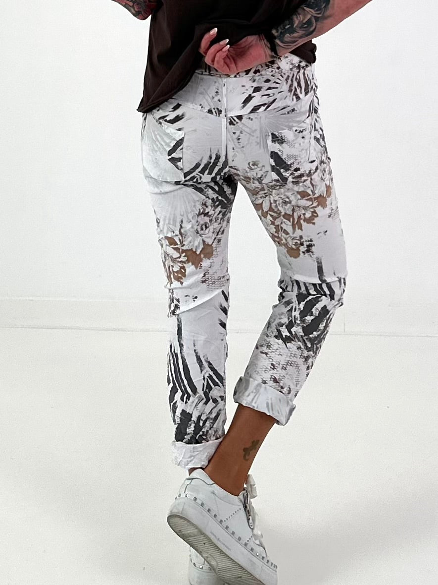 All-over patterned trousers - white-multicoloured