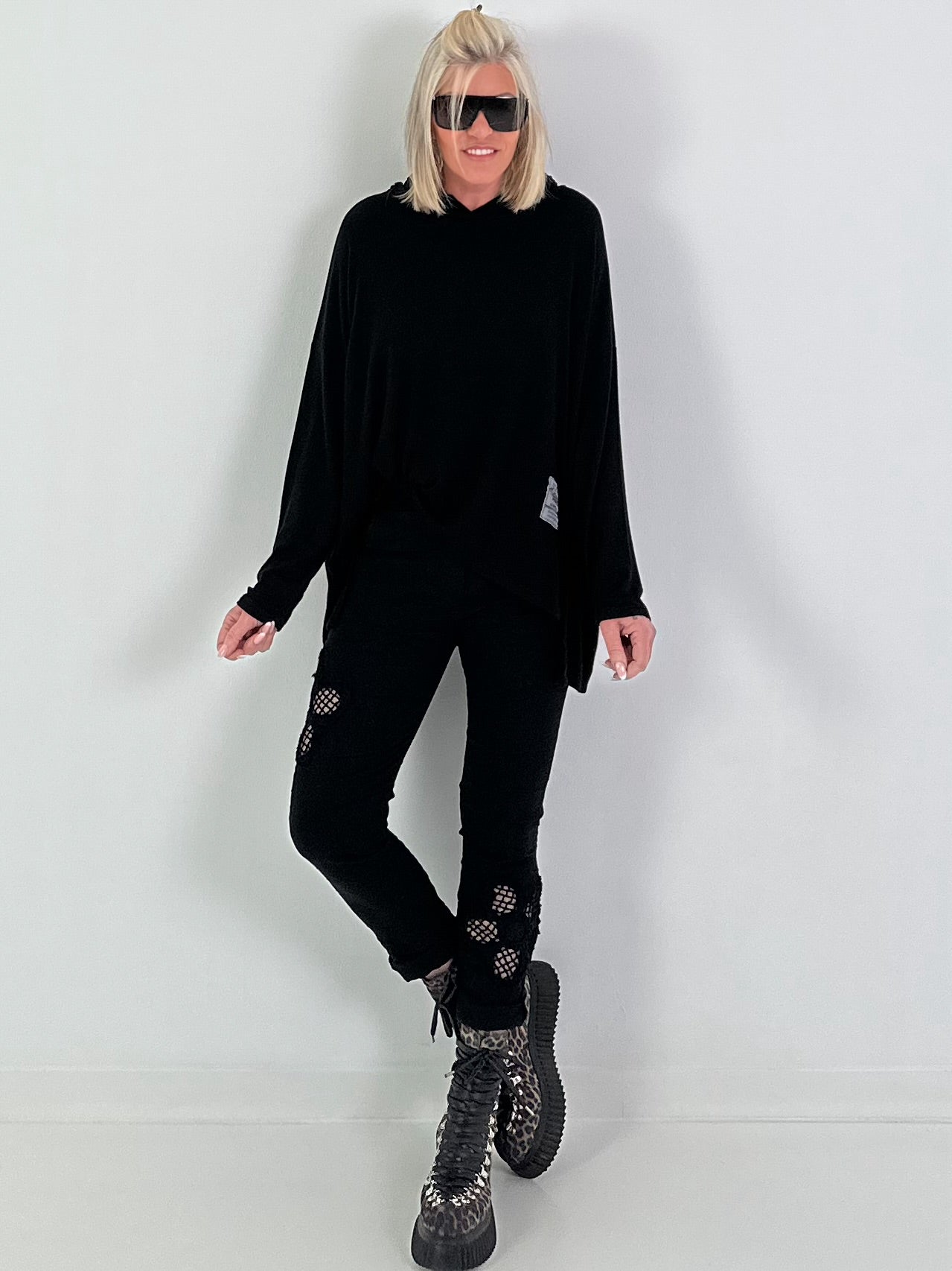 Trousers with crocheted flower inserts - black