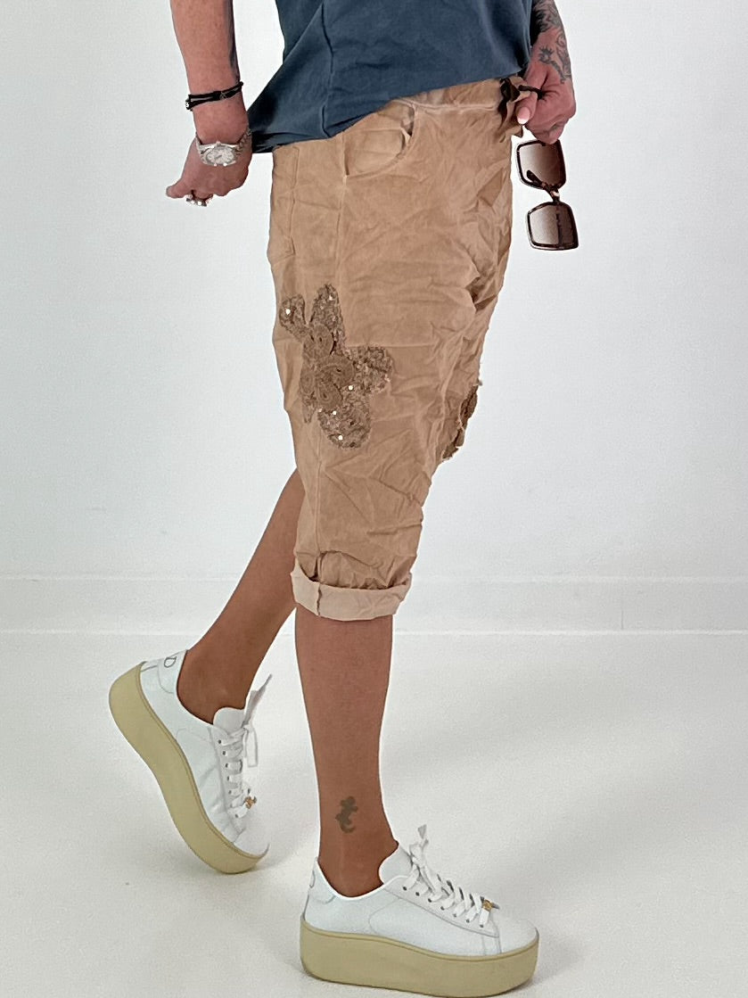 Short baggy shorts with crocheted flowers and sequins - camel