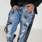 Boyfriend Jeans mit allover Sternen-Print und Ledereinsätzen - schwarz-denim