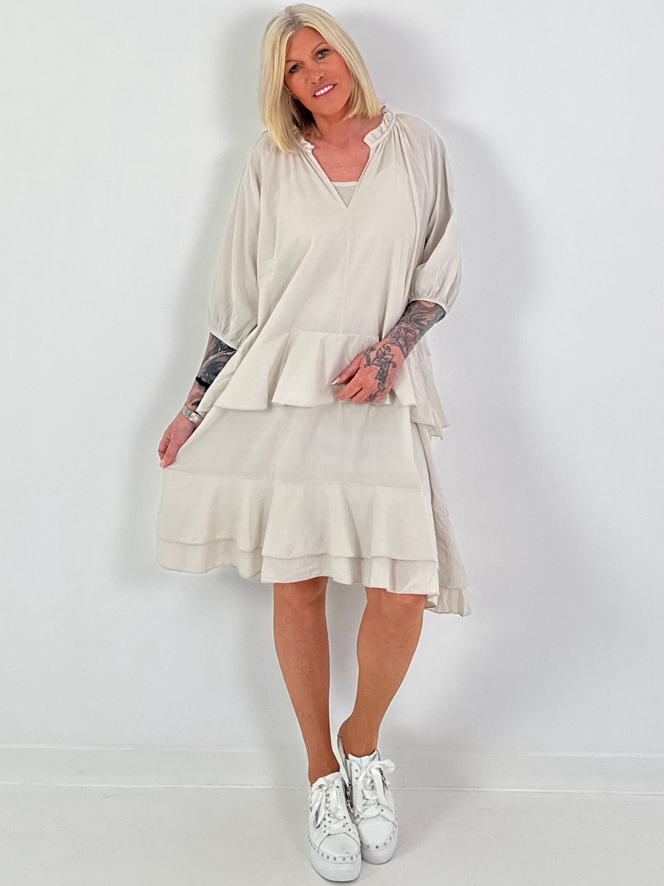Dress with undershirt top and flounces - beige