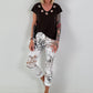 All-over patterned trousers - white-multicoloured