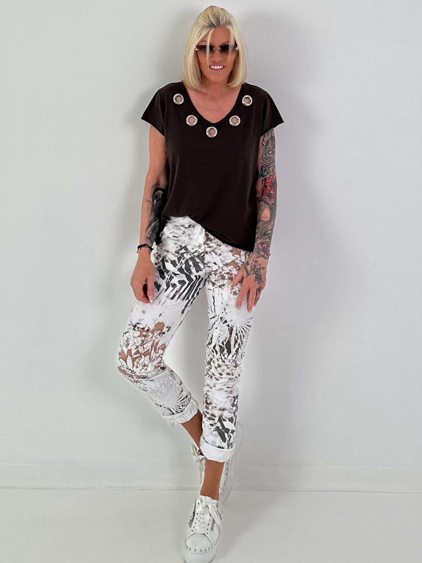 All-over patterned trousers - white-multicoloured