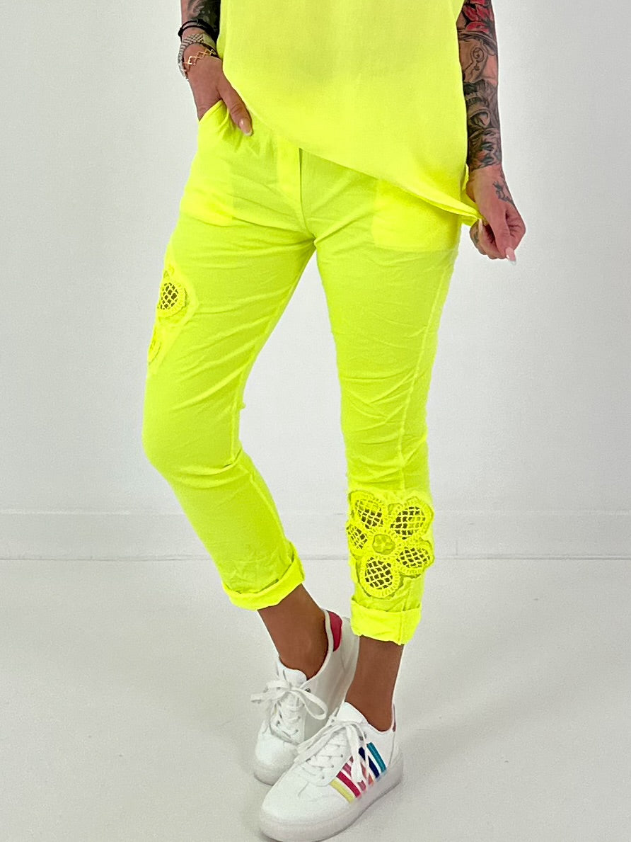 Pants with crocheted flowers - neon yellow