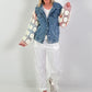 Denim jacket with crocheted sleeves