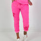 Broek met gehaakte bloemen - neonroze