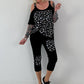 Shirt mit Cold Shoulder und Leo Strass - schwarz