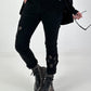 Trousers with crocheted flower inserts - black