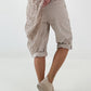 Kurze Hose mit Jeanselementen und Ösen - beige