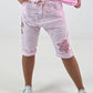 Short baggy shorts with crocheted flowers and sequins - pink