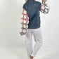 Denim jacket with crocheted sleeves