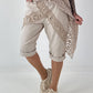 Kurze Hose mit Jeanselementen und Ösen - beige