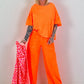 Sweatpants with large side pockets - neon orange