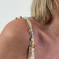 Dress with decorative straps and stripe pattern - beige