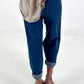 Dark blue jeans with silver eyelets