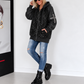 Jacke im Materialmix mit Pailletten und Strasskreuz - schwarz