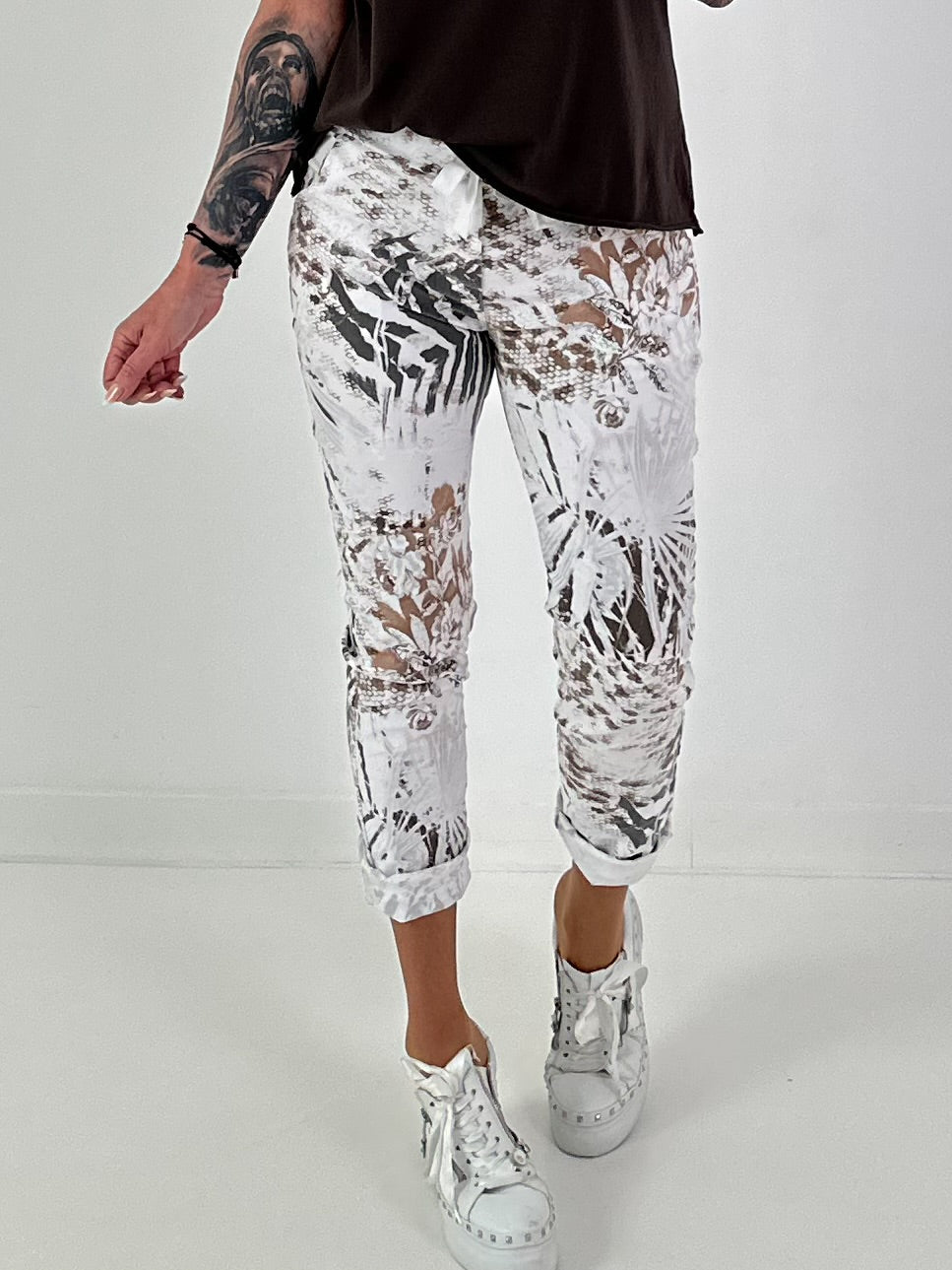 All-over patterned trousers - white-multicoloured