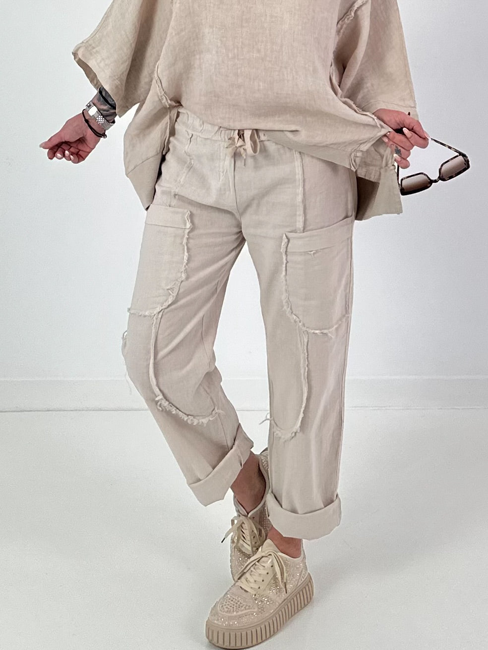 Linnen broek met opgestikte zakken en franjes - beige