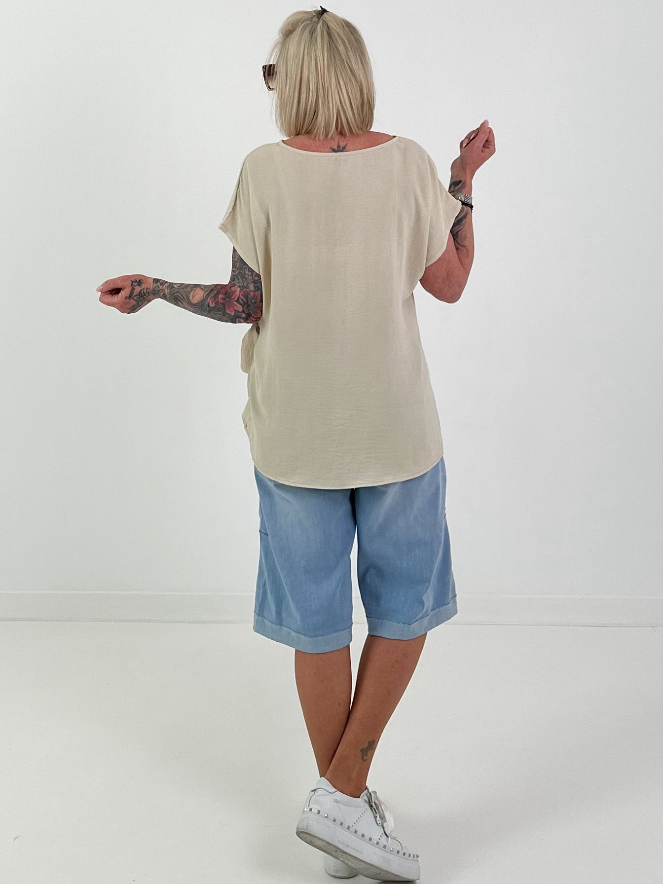 Blouse met strikknoop aan de zijkant - beige