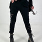 Trousers with crocheted flower inserts - black