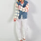 Denim jacket with crocheted sleeves