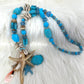 Shell necklace with starfish pendant - light blue